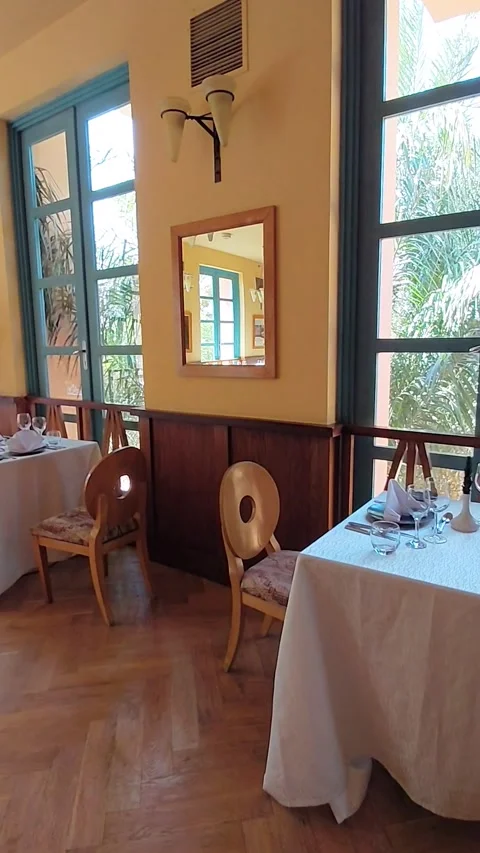 Cozy restaurant dining room interior with served tables in El Gouna Egypt. Stock Footage 340108977