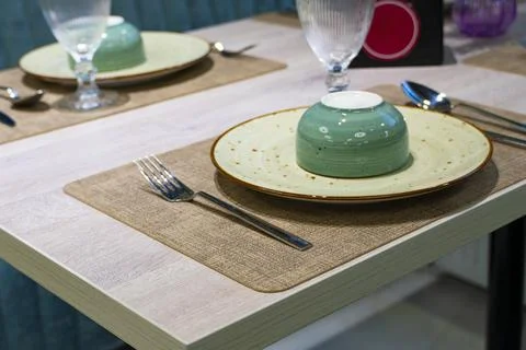 Cozy restaurant interior with table setting Stock-Fotos