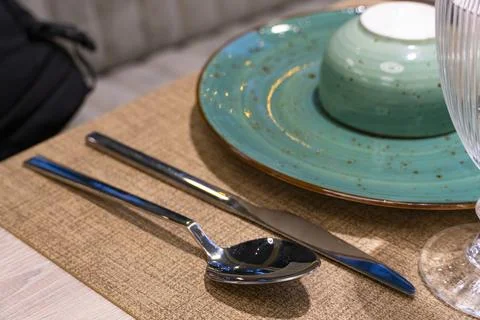 Cozy restaurant interior with table setting Stock Photos