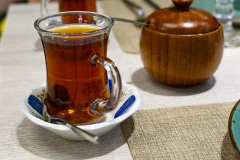 Cozy restaurant interior with table setting Stock Photos