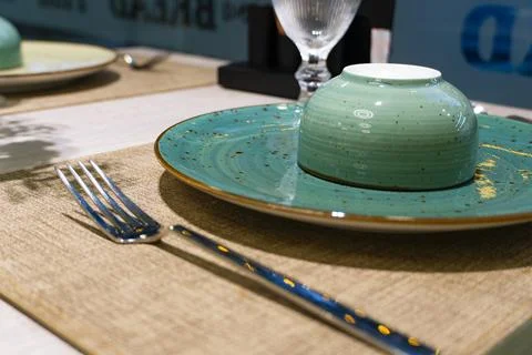 Cozy restaurant interior with table setting Stock Photos