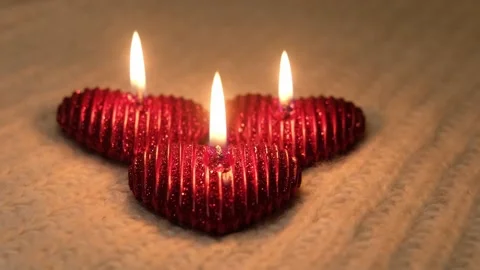 Cozy, romantic Valentine's Day. Composition with candles and knitted elements Stock Footage 231780077