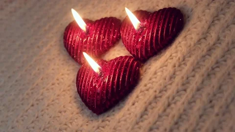 Cozy, romantic Valentine's Day. Composition with candles and knitted elements Stock Footage 231780127