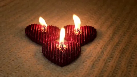 Cozy, romantic Valentine's Day. Composition with candles and knitted elements Stock Footage 231780182