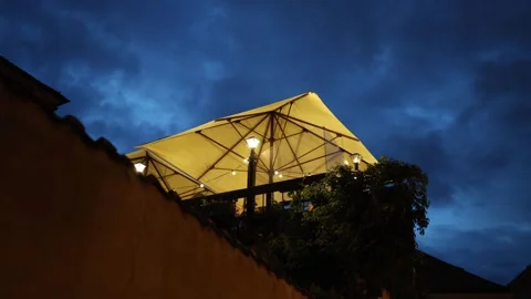 Cozy rooftop terrace at night Stock Footage 335920997