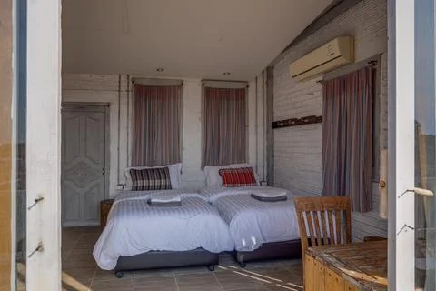 Cozy rustic bedroom with comfortable bed and wooden furniture 写真素材