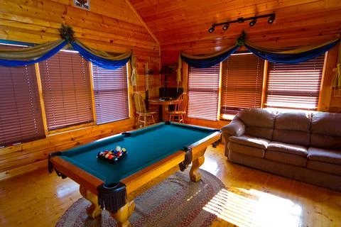 Cozy Rustic Cabin Interior with Pool Table and Leather Sofa in Tennessee 写真素材