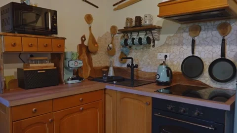 Cozy Rustic Kitchen Interior with Vintage Appliances and Wooden Cabinets Stock Footage 340000885