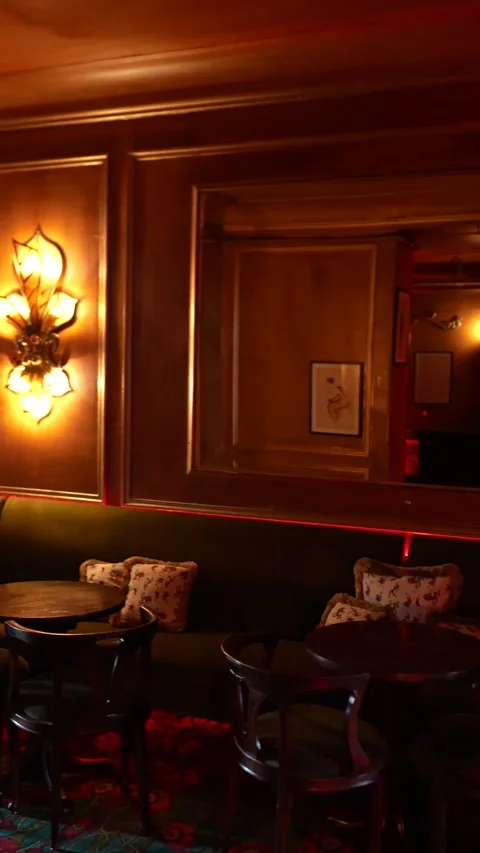Cozy seating area in Maxims restaurant Paris July 17 2025 Stock Footage 318778815