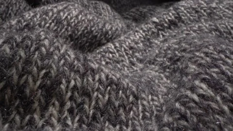 Cozy sheep wool fabric texture in macro. Handcraft knitting woolen soft sweater Stock Footage 156533968