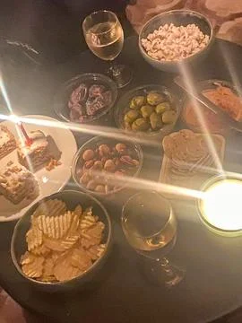 Cozy snack table with candlelight Stock Photos