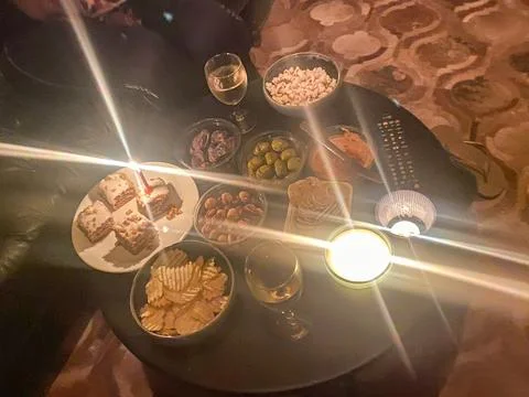 Cozy snack table with candlelight Stock Photos