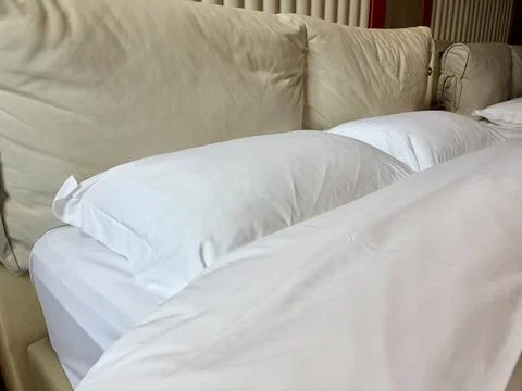 Cozy Sofa Bed with White Pillows and Blanket 스톡 사진