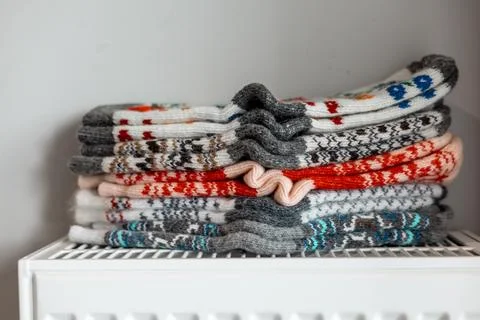 A cozy stack of colorful, patterned wool socks ready for a cold day. A stack of Stock Photos