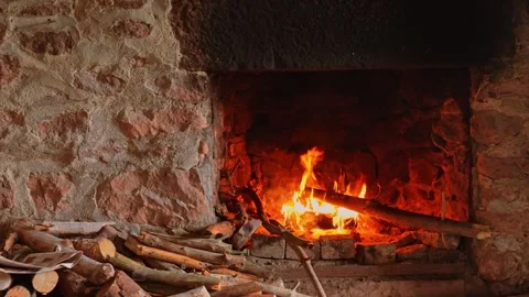 Cozy stone fireplace with burning logs Stock Footage 324665356