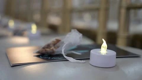 A Cozy Table Setting Enhanced by Soft LED Candlelight and Delectable Treats for Video stock 295008761