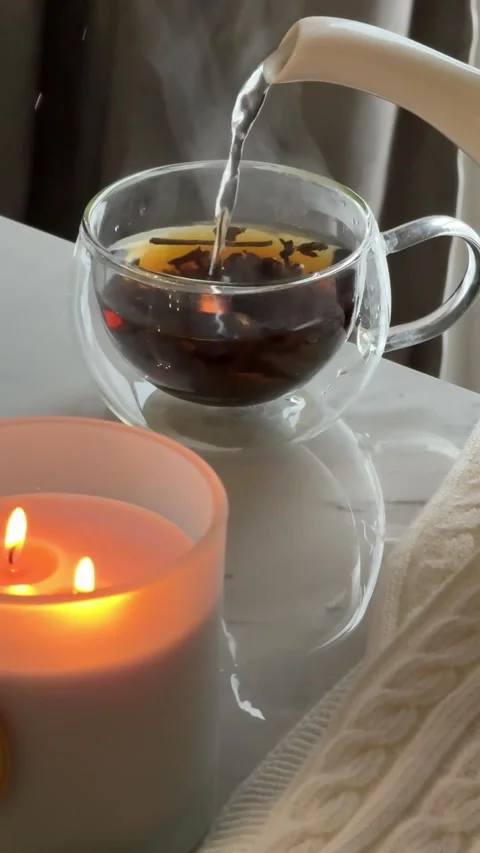 Cozy Tea &amp; Candlelight: Relaxing Evening Setup Video stock 343552597