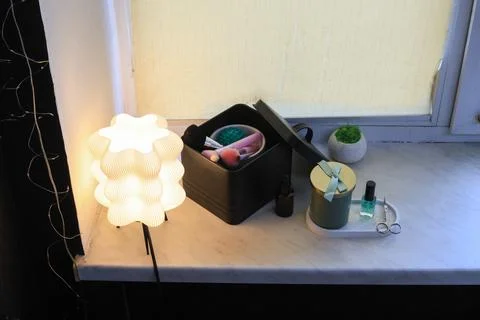Cozy vanity corner with makeup brushes, nail polish, and decorative items Stock Photos