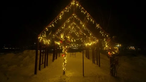 A cozy winter night scene featuring a tunnel-like Stock Footage 328418385