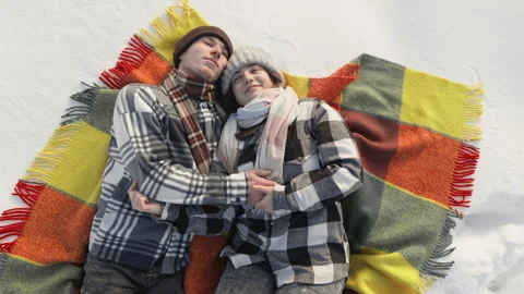 A Cozy Winter Picnic Two Lovers Enjoying a Beautiful Snowy Day Together in the Video stock 286711550