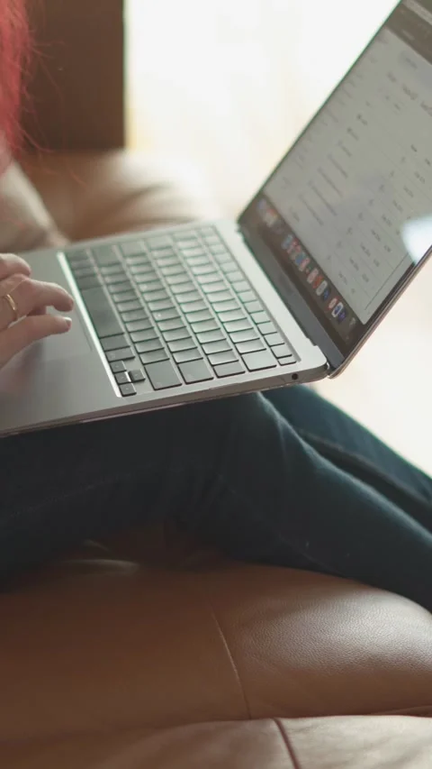 A Cozy Workspace A Focused Individual Working Productively on Their Laptop Stock Footage 293146706