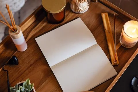 Cozy Workspace with open notebook for journaling on a wooden tray Stock Photos