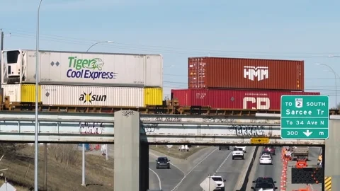 A CP freight train carrying intermodal containers crosses a bridge 스톡 동영상 333446711