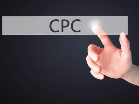 CPC - Hand pressing a button on blurred background concept on visual screen. Stock Photos