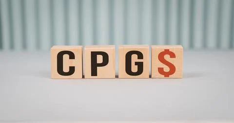 CPG , Consumer Packaged Goods, words in wooden cubes on blue background as .. Stock Photos