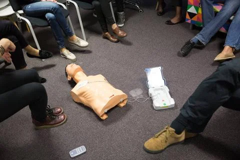 CPR course using automated external defibrillator device, AED. First aid c... Stock Photos