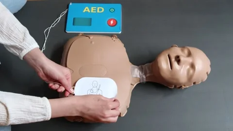 CPR on practice doll. Stock Footage 253075092