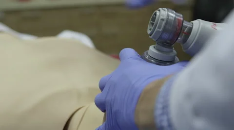 CPR resuscitation exercise on phantom - shocking Stock Footage 58333178