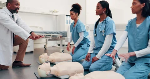 Cpr, teaching and doctor with demonstration for nurse team, compression 库存影片 344371638