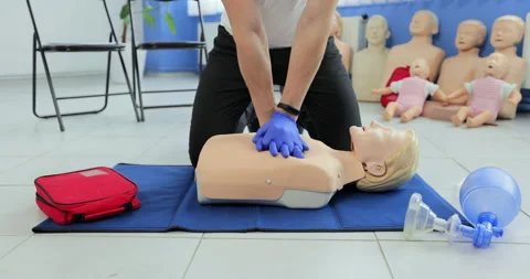 CPR training and First Aid Instruction. First Aid cardiopulmonary resuscitation. Stock Footage 163980227