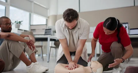 Cpr, training and mannequin with man and instructor for First aid, workshop and Stock Footage 297170886