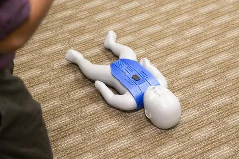 CPR training class by security guard in office Stock Photos