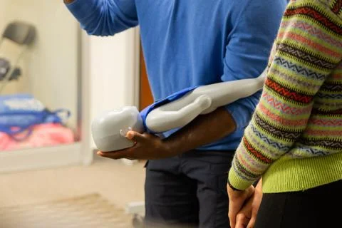 CPR training class by security guard in office Stock Photos