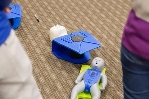 CPR training class by security guard in office Stock Photos