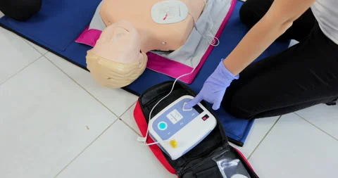 CPR training medical procedure workshop. Demonstrating chest compressions and Stock Footage 163975778