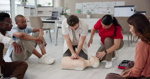 Cpr, workshop and mannequin with man and instructor for First aid, training and Stock Footage 297172052