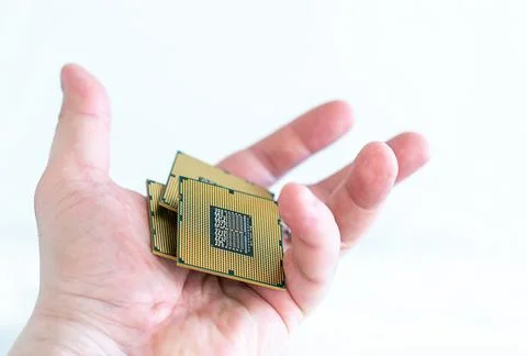 CPU central processing unit in open hands of a man on an isolated background 스톡 사진