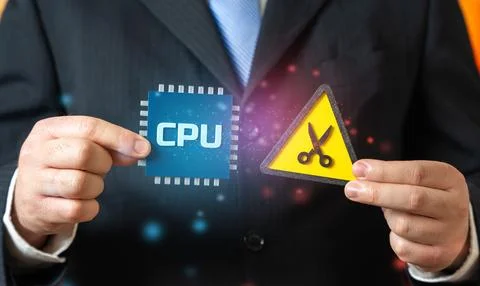 CPU chip and scissors. A reduction in the number of chips produced. Supply .. Stock Photos