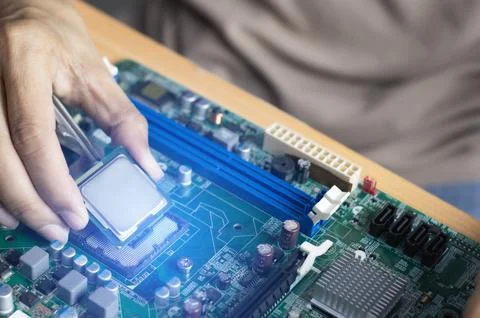 CPU chip, important computer part computer repair technician Stock Photos