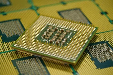 CPU close up highlighting precise alignment of pins for electrical efficiency Stock Photos