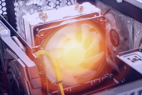 The CPU cooling system on the computer. Cooler with fan. Stock Photos