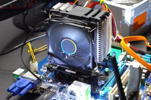 CPU cooling system. Cooler with radiator on the motherboard. Stock Photos