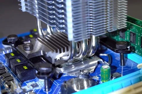 CPU cooling system. Cooler with radiator on the motherboard. Stock Photos