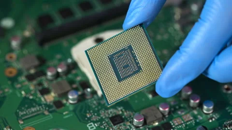 CPU in hand before installation into the motherboard Stock Footage 61636878