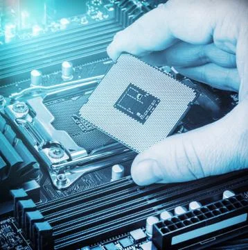 CPU in hand before installation into the motherboard 스톡 사진