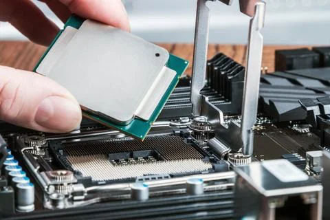 CPU in hand before installation 스톡 사진